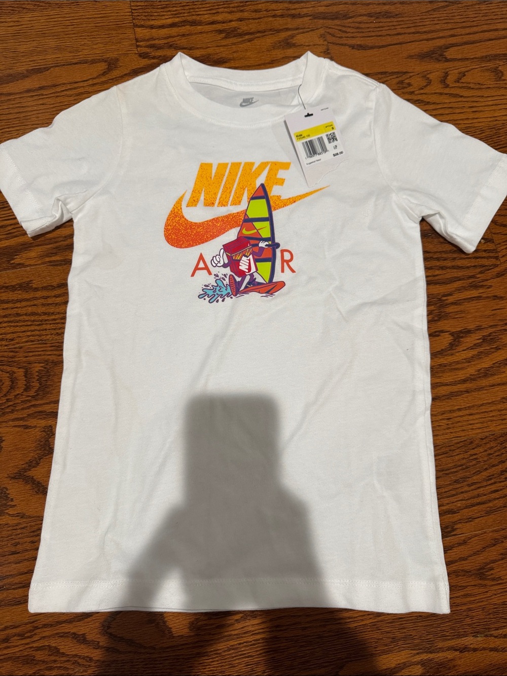 Nike White Short Sleeve Tee with Orange Swoosh and Multicolor Windsurf Graphic